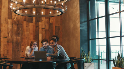 Work together for success. Co-workers have a lunch in a modern cafe