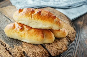 Freshly baked fragrant homemade small meat pies with an appetizing crust. Russian national cuisine