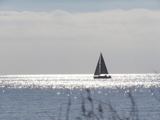 Sailboat far away on the sea