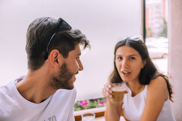 Portrait of a very fashionable young couple having fun in the city
