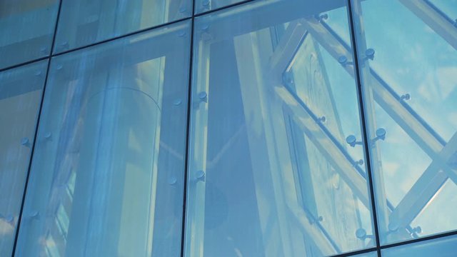 Glass Curtain Facade Wall. Fasteners Elements of Spider Glass System. Facade Detail. Architecture Abstract Background. Showcase of a Modern Building Tilt Up