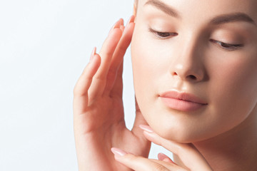 Young beautiful woman with clean perfect skin close-up