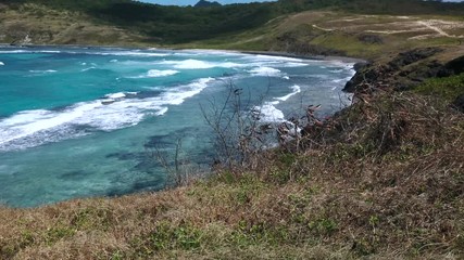 Fernando de Noronha Island, Mirante Buraco da Raquel beach, a UNESCO World Heritage site, Pernambuco, Brazil - July, 2019 - Beautiful Tropical 4k footage of the beach.