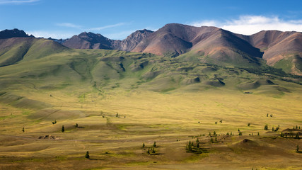 Fototapeta na wymiar mountain panorama of Chui mountain range in Altai with snow, Russia, June