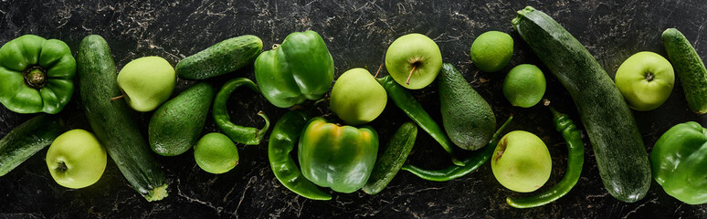 panoramic shot of whole apples, limes, peppers, cucumbers, avocados and zucchini