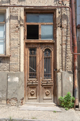 Old door in a brick house