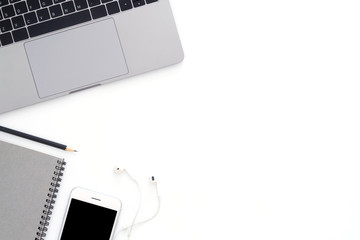 Creative flat lay photo of workspace desk. Top view office desk with laptop, phone, pencil and...