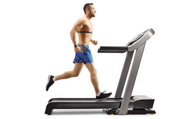 Man running on a treadmill with a chest monitor