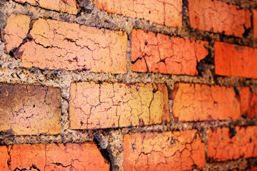 Old red brick wall illuminated from above