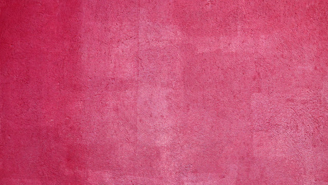 Textured pink wall background facade
