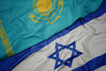 waving colorful flag of israel and national flag of kazakhstan.