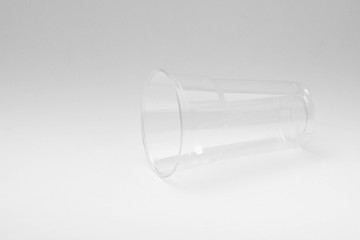 plastic water glass on pale white background