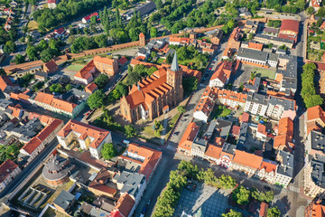 Fototapeta na wymiar Aerial view of a Gothic church in a small town in Europe