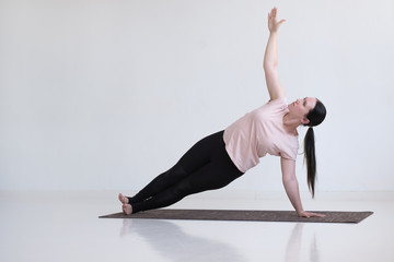 Caucasian woman doing exercises, Side Plank Pose, Vasisthasana, Yoga Pose, isolated on white background