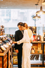  bright emotions in a family photo shoot. happy couple in the interior of a wine bar.
