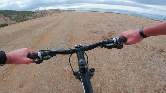Mountain bike ride seen from point of view of the rider