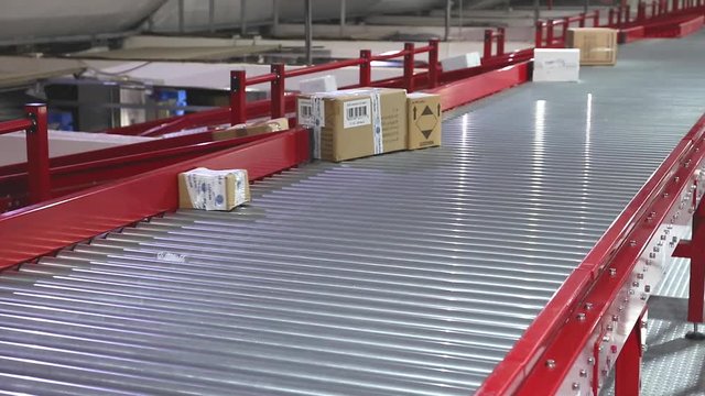 Conveyor Belt Sorting Shipping Delivery in Distribution Warehouse