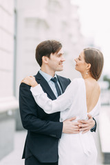  love story in the European style. happy couple on the background of the evening city.