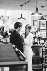happy couple in the interior of a wine bar. bright emotions in a family photo shoot.