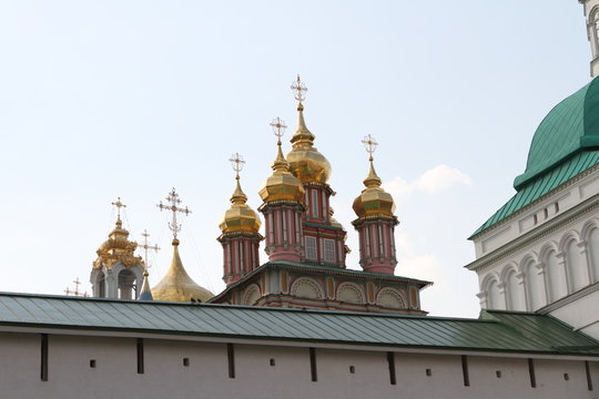 Domes with crosses of the temple complex against the clear sky