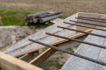 Fototapeta premium Reinforcing bars sticking out of reinforced concrete slab.