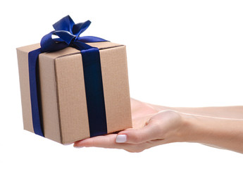 Brown box with blue ribbon bow gift in hand