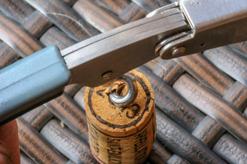 Opening Of Bottle Of Wine With Corkscrew. Close-up