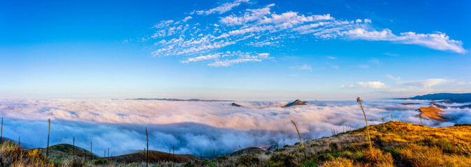 Panorama of sea of Clouds in Valley and Mountains
