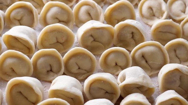Homemade meat dumplings, closeup. Russian traditional meal. Rotate
