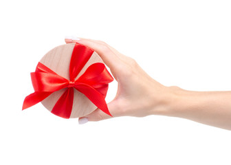 Box with red ribbon bow gift in hand on white background isolation
