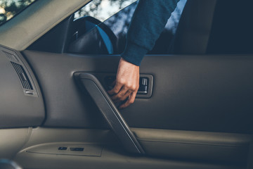 Fototapeta na wymiar man thief hand in car