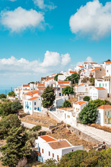 Typical Greek mountain village of Nikia with white houses and red roofs, Nisyros Island, Greece