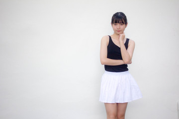Portrait of thai adult beautiful girl black shirt white skirt relax and smile
