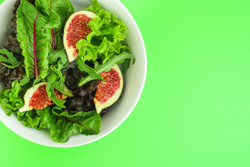 salad figs, leaves  lettuce (chard, onions, herbs and other ingredients) top concept. food background. copy space