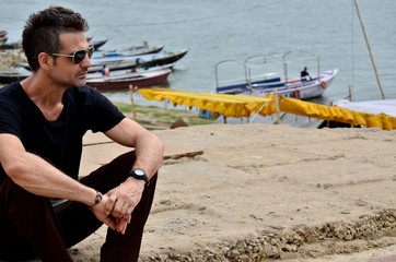 Man with sunglasses sitting in Varanasi, India