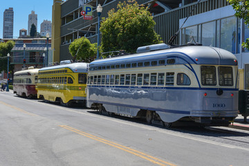 Fototapeta na wymiar parked electric tramcars on a city street