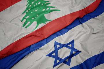 waving colorful flag of israel and national flag of lebanon. - obrazy, fototapety, plakaty