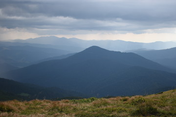 View while climbing Mount Hoverla. View of the mountain, forests and clouds. Ukrainian Carpathians.