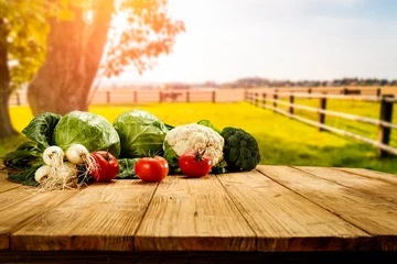 Foto auf Leinwand Table background with fresh vegetables and sunny autumn view.  © magdal3na