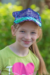 Portrait of a girl in a cap