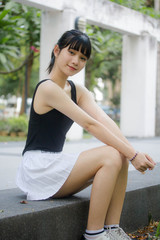 Portrait of thai adult beautiful girl black shirt white skirt relax time