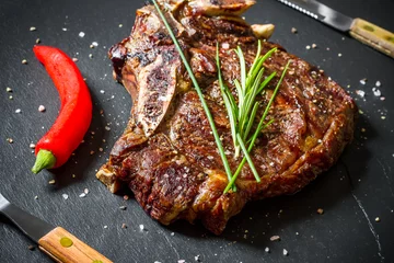 Rolgordijnen Grilled club steak on slate plate © diamant24