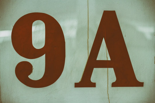No. 9A red numbers on old concrete and old white backgrounds.
