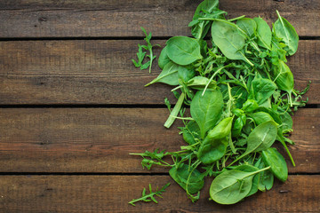 salad leaves mix (chard, lettuce, spinach, arugula, basil and more) concept top. food background. copy space