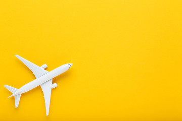Airplane model on yellow background