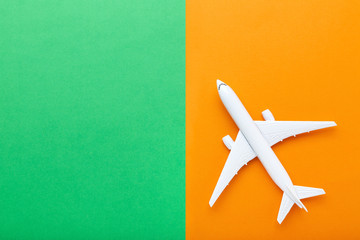 Airplane model on colorful paper background