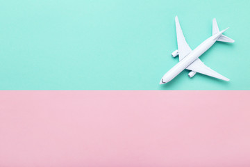 Airplane model on colorful paper background