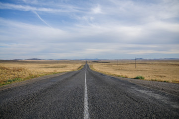 Fototapeta na wymiar Deserted road in central Kazakhstan