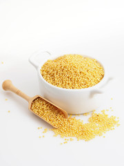 Dried raw millet on the white background