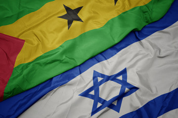 waving colorful flag of israel and national flag of sao tome and principe .